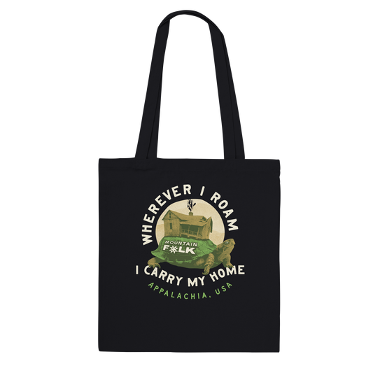 Black tote bag with a turtle Mountain FOLK design. Wherever I Roam I Carry My Home