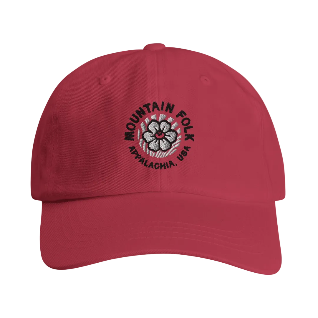 A red cap with the 'Mountain FOLK' logo embroidered in green and the text 'APPALACHIA, USA' below it.