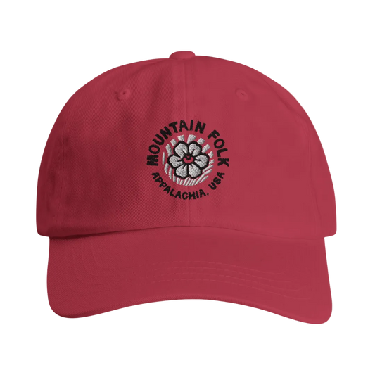 A red cap with the 'Mountain FOLK' logo embroidered in green and the text 'APPALACHIA, USA' below it.