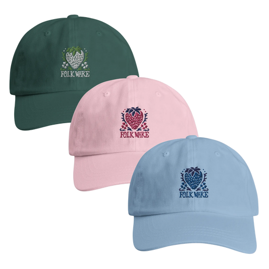 Three baseball caps in green, pink, and blue with 'Folk Ware' logo 