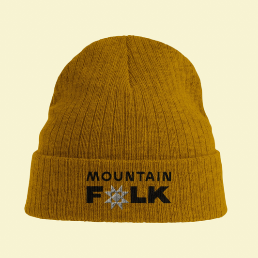 A mustard yellow beanie with 'Mountain FOLK' text logo on the front.